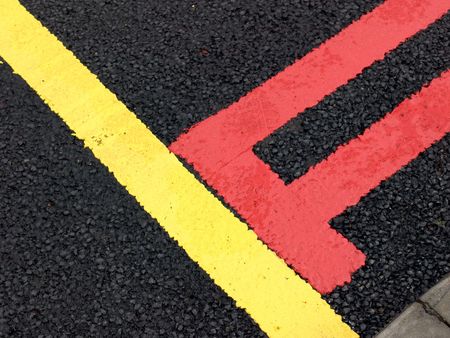 Red and yellow  road lines on new road