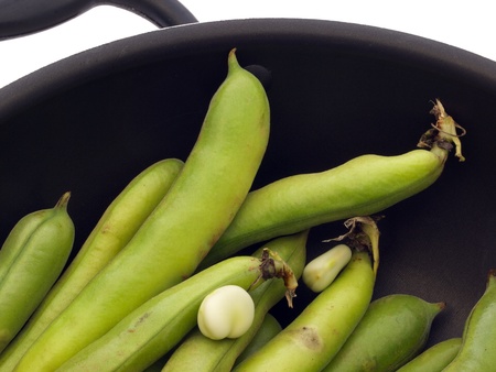 Pan of fresh broad bean podsの写真素材