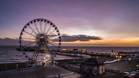 The Victorian Brighton Pier, also known as the Palace Pier and the Brighton wheel after sunsetのeditorial素材