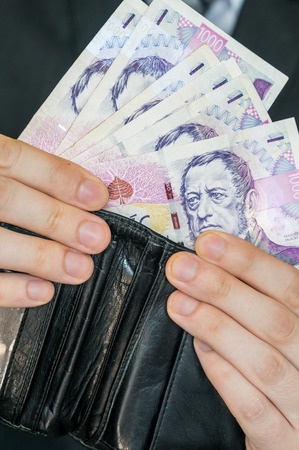 Man holds Czech money.の写真素材