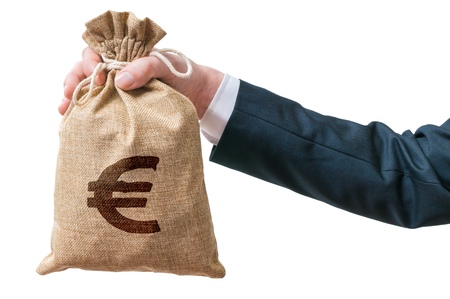 Hand of businessman holds bag full of money with Euro sign. Isolated on white background.の写真素材
