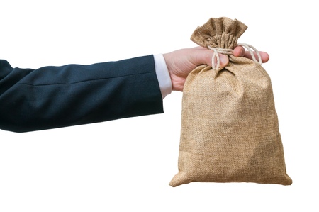 Businessman holds bag full of money. Isolated on white background.の写真素材