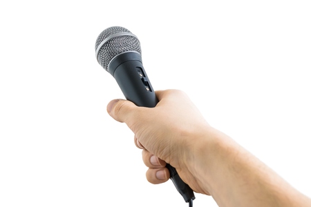Reporter is holding microphone in hand. Isolated on white background.の写真素材
