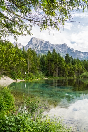 Alps mountains and lake in Almsee in Austria.の写真素材
