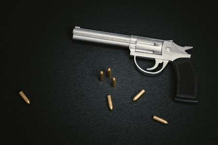 Crime scene. Gun with many bullets on black leather background. 3D rendered illustration.