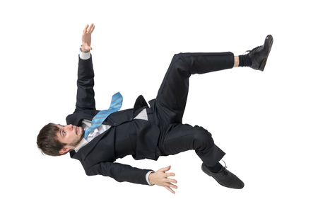 Businessman is falling down. Isolated on white background.の写真素材