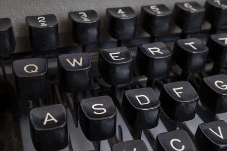 Close-up view on vintage black typewriter keyboard.