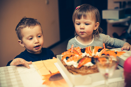 Children's going to eat a tasty cakeの写真素材