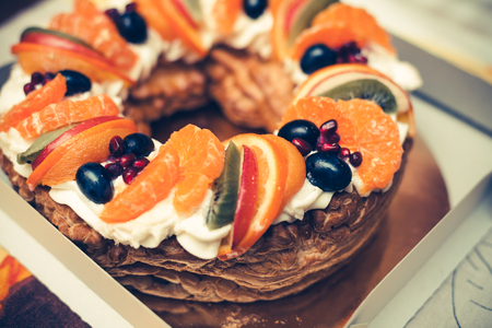 Round tasty fruit cake with different fruitsの写真素材