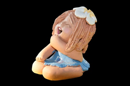 Smile ceramic doll isolated in black                   の写真素材