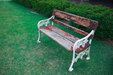 old wood bench in garden backgroundの写真素材