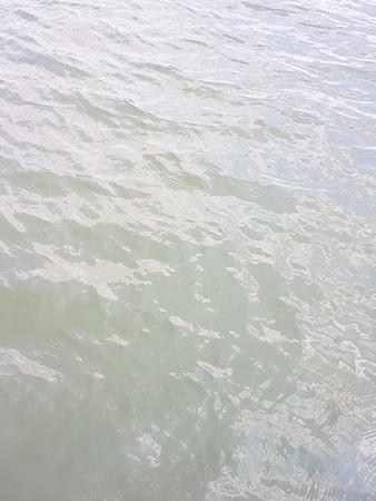 water wave of river with sunlight effected background
