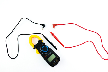 Yellow clamp meter with black body with red and black line isolated on white backgroundの写真素材