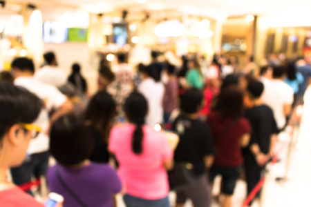 Blurry of people who are waiting for buy goods. Blurred people in a long queue for shopping.