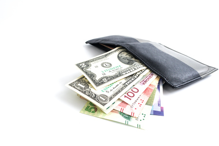 Multi currency banknotes in the men's wallet around with asian banknotes isolated on whtie backgroundの写真素材