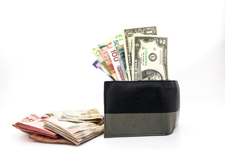 Multi currency banknotes in the men's wallet around with asian banknotes isolated on whtie...
