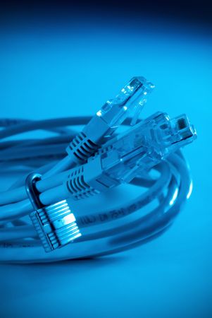 A high tech blue tint closeup of nertwork cables surrounded by a padlock
