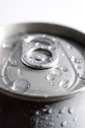 SHallow focus macro of a can of soda with dew from ice