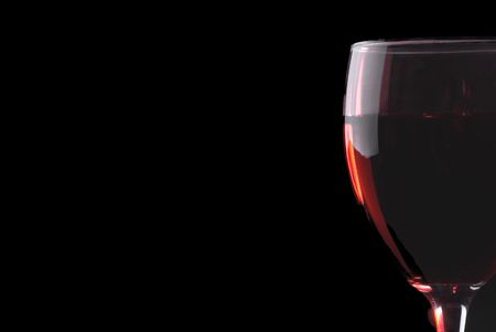 Low key red wine glass on a black backgroundの写真素材