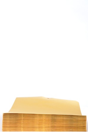 A stack of white envelopes with space for copy