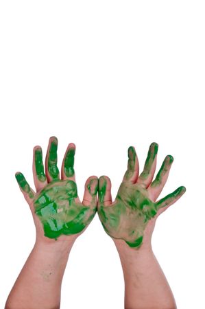 A child's hands covered in green paint on whiteの写真素材