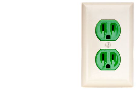 horizontal image of a green power outlet receptacle with copy spaceの写真素材