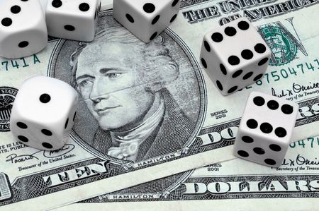 American money surrounded by dice