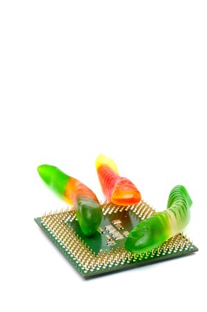Vertical shallow focus close up of a computer CPU chip with a worm virusの写真素材