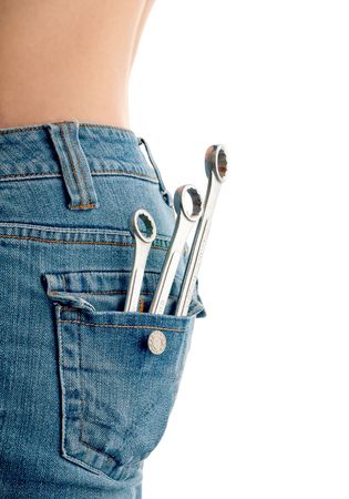 Vertical image of wrenches in an attractive females back pocketの写真素材
