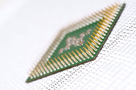 A tilted view of a computer CPU chip on binary codeの写真素材