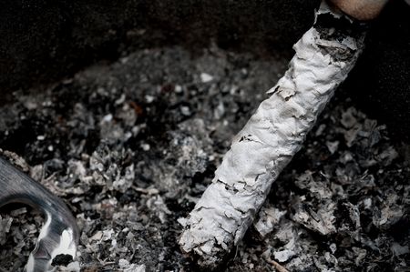 Burnt cigarette in an ashtray