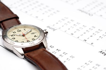 A wristwatch on a calendarの写真素材