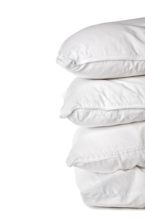 A stack of 4 white pillowcases on whiteの写真素材