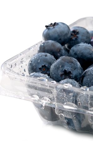 Fresh blueberries in a plastcic clear containerの写真素材