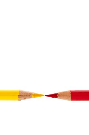 Brightly colored red and yellow pencils isolated on whiteの写真素材
