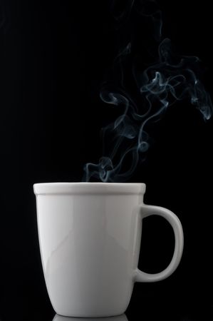 a white cup with a steaming hot drinkの写真素材