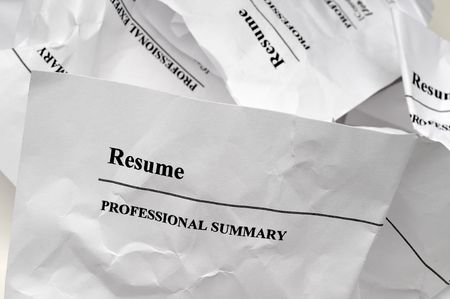 resumes crumpled up and tossed in frustrationの写真素材