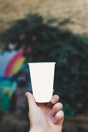 Paper cup on a background of urban landscapesの写真素材