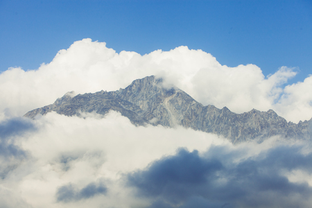 The peak of the mountain in the cloudsの写真素材