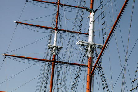 Sailing yacht. Mast for sails. The sails are folded