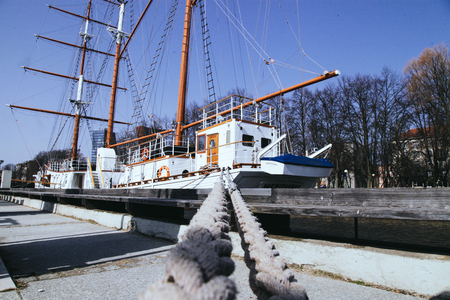 The old sailing ship is moored in the city of Klaipeda Lithuania.