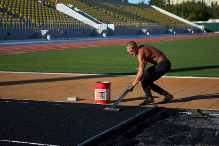 15.09.2021 Ukraine. Kryvyi Rih. Large construction of the reconstruction of the stadium. Workers...