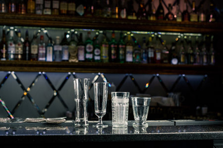 empty cocktail glasses at the bar