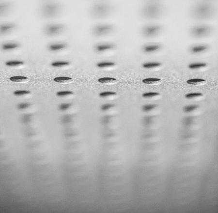 Abstract plate with round holes, backgroundの写真素材