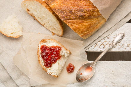 piece of white bread with raspberry jam