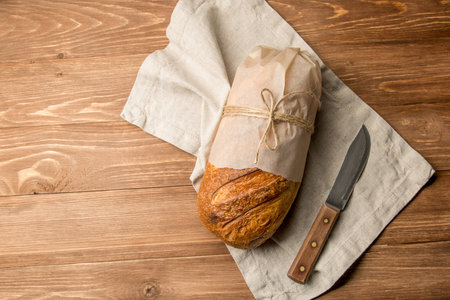 Fresh loaf of bread and a butter knife