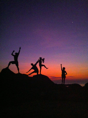 Friendship fitness on the cliff in the summer.の素材