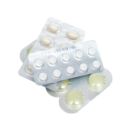 Pills in a blister pack on a white backgroundの写真素材