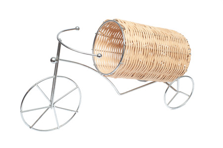 Support under a bottle with wine in the form of a bicycle with the wattled container.の写真素材