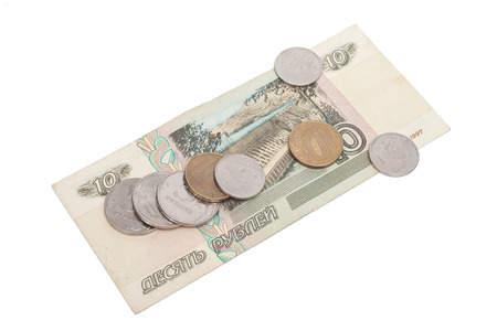 Russian rubles banknotes and coins over white